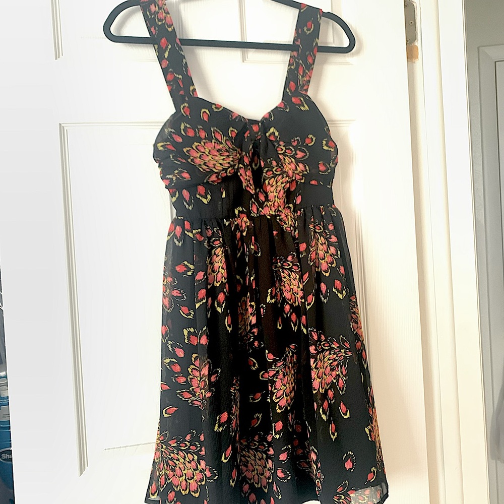Black dress with peacock patter fabric